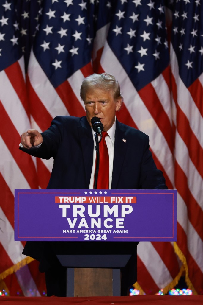 President-elect Donald Trump speaks from a podium at his election victory party.