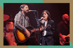 Noah Kahan (L) and Gracie Abrams perform together in concert.