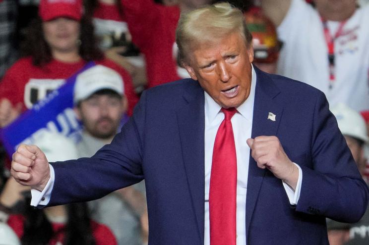 Former President Donald Trump reacting during a campaign rally at PPG Paints Arena in Pittsburgh, Pennsylvania.