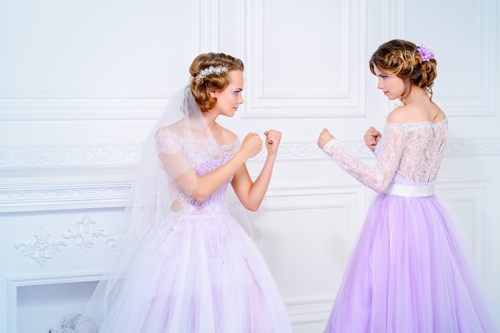 A bride and bridesmaid fighting. 