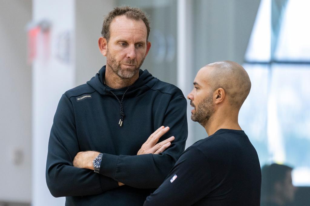 Brooklyn Nets GM Sean Marks in discussion with head coach Jordi Fernandez during a practice session at the HSS Training Center in Brooklyn, NY, on October 1, 2024.