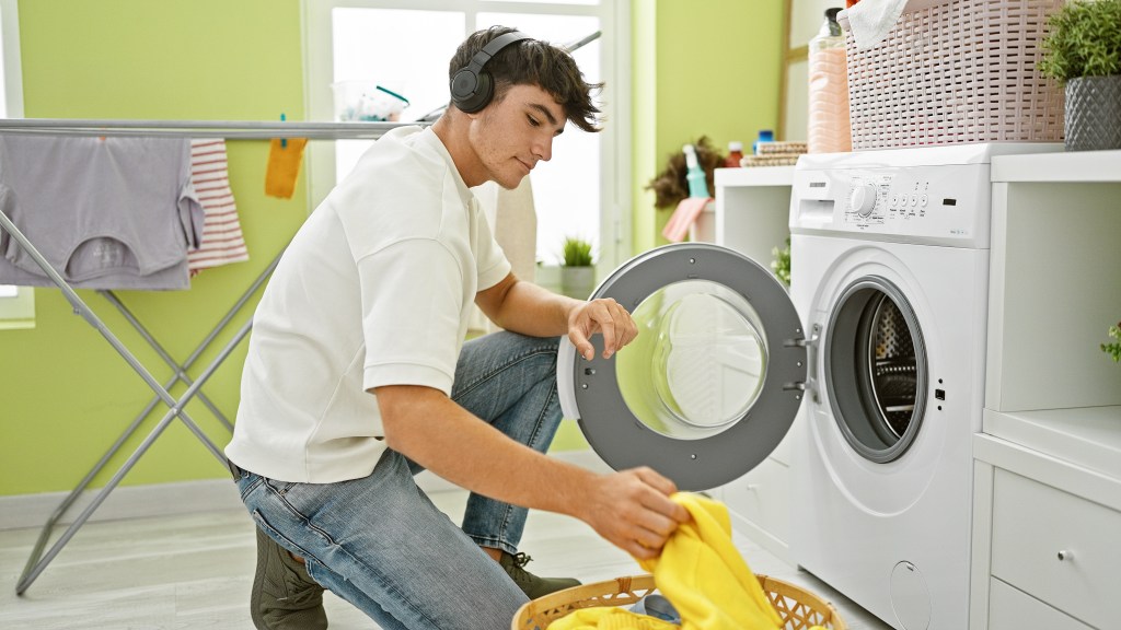 Young man doing laundry