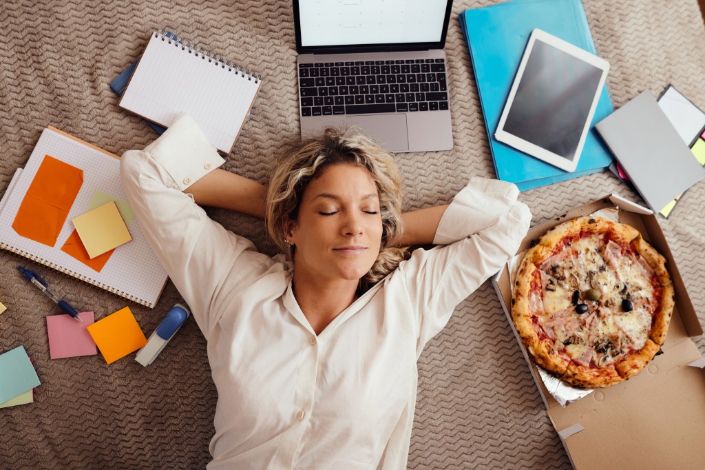 A woman relaxing while at work. 