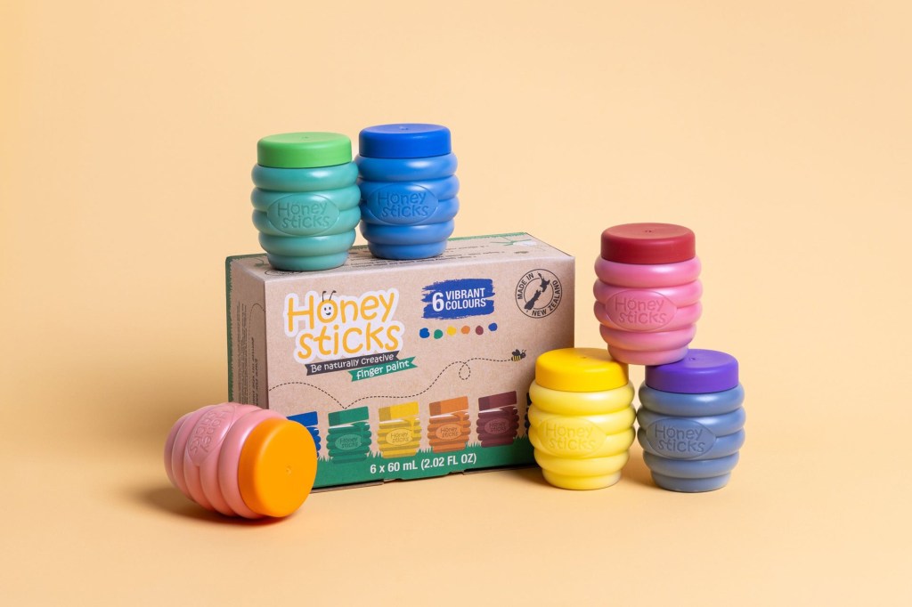 A group of colorful jars labeled as honeysticks