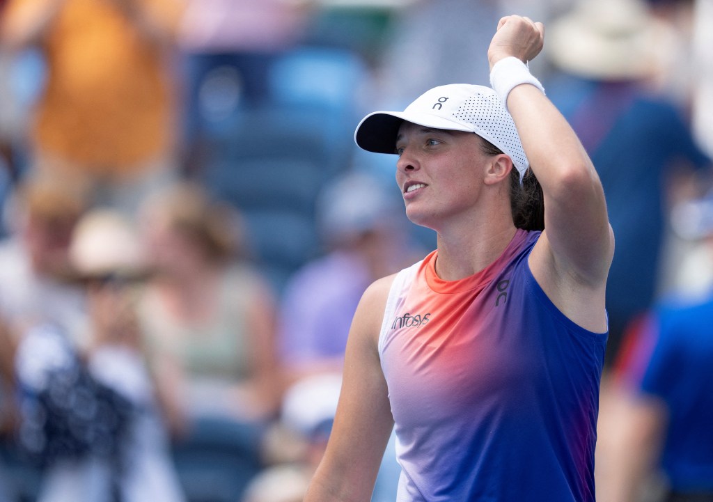  Iga Swiatek of Poland celebrates winning her match against Mirra Andreeva on day six of the Cincinnati Open.