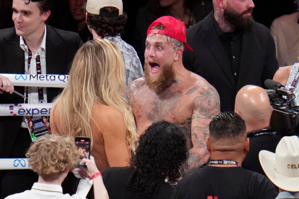 Jake Paul reacts after defeating Mike Tyson during their heavyweight boxing match, Friday, Nov. 15, 2024, in Arlington, Texas.