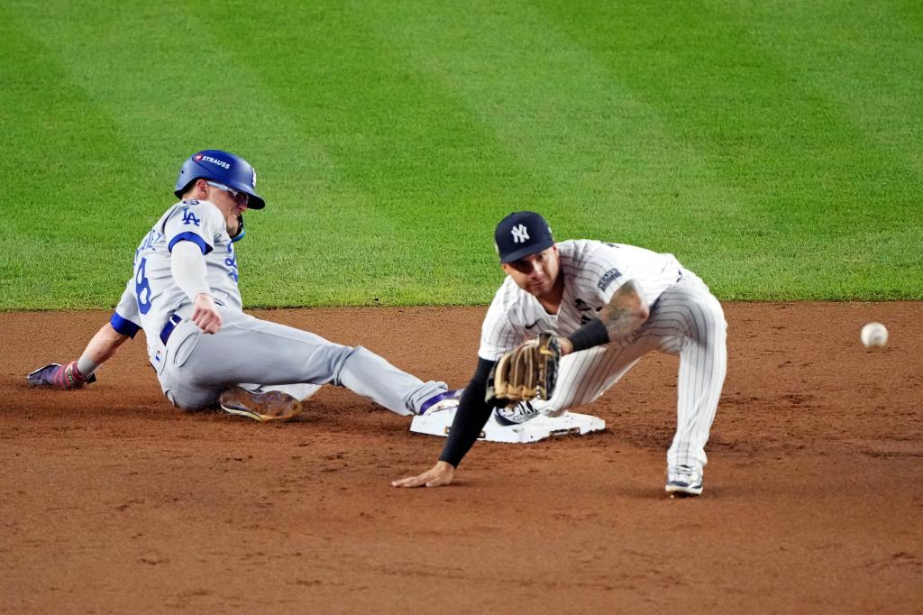 Los Angeles Dodgers third baseman Enrique Hernandez (8) reaches second base against after outfielder Aaron Judge (not pictured) dropped a fly ball during the fifth inning in game four of the 2024 MLB World Series at Yankee Stadium. 