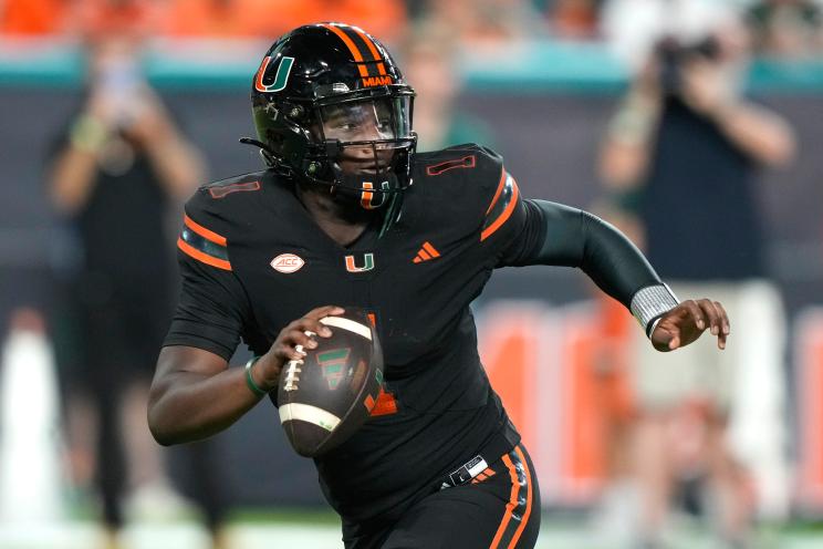 Miami quarterback Cam Ward looks to pass during the first half of an NCAA college football game against Florida State, Saturday, Oct. 26, 2024, in Miami Gardens, Fla.