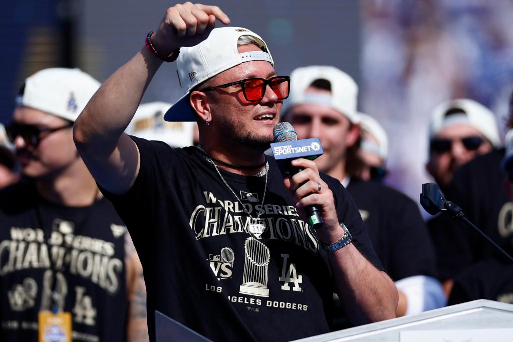 Miguel Rojas of the Los Angeles Dodgers speaks during the 2024 World Series Celebration at Dodger Stadium.