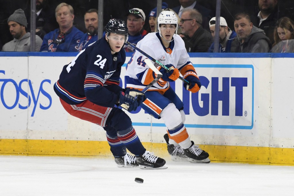 Kaapo Kakko, left, and Islanders' Jean-Gabriel Pageau, right, pursue the puck during the second period.