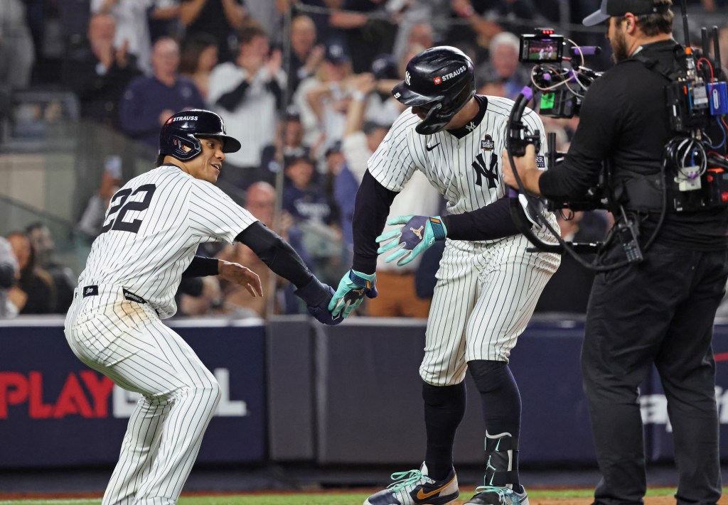 Yankees' Aaron Judge #99 celebrates with Juan Soto #22 after he scores on his two-run home run.