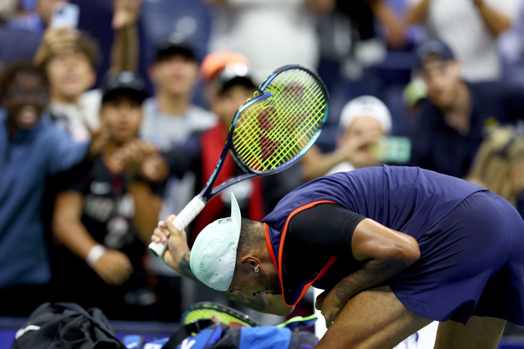 Nick Kyrgios of Australia smashing his tennis racket in frustration after being defeated by Karen Khachanov at the 2022 US Open Men's Singles Quarterfinals.