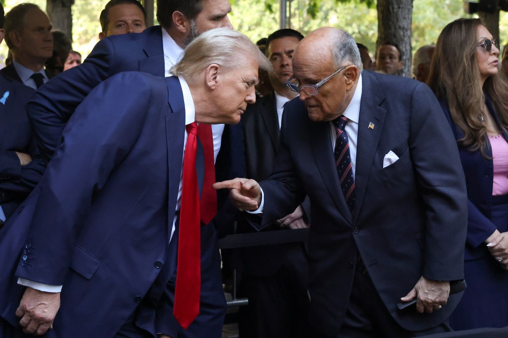 Donald Trump, left, talks with Giuliani while attending the 9/11 Memorial ceremony Wednesday, Sept. 11, 2024, in New York.