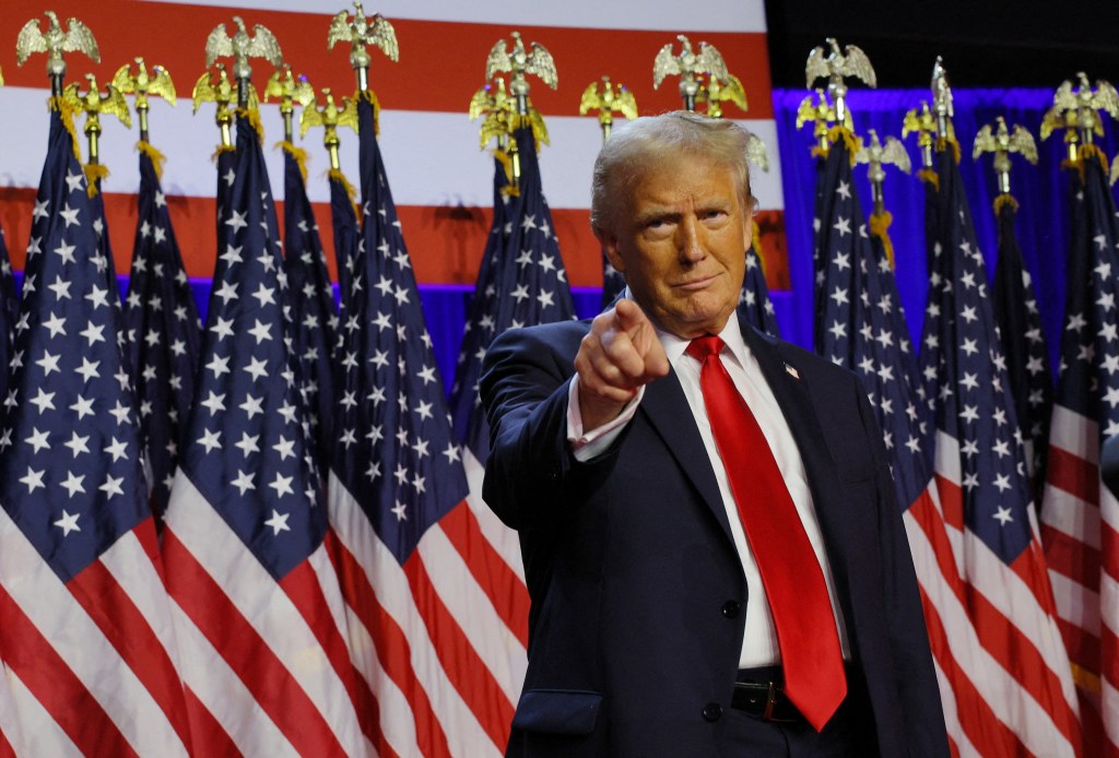 Republican presidential nominee and former U.S. President Donald Trump takes the stage to address supporters at his rally, at the Palm Beach County Convention Center in West Palm Beach, Florida, U.S., November 6, 2024.