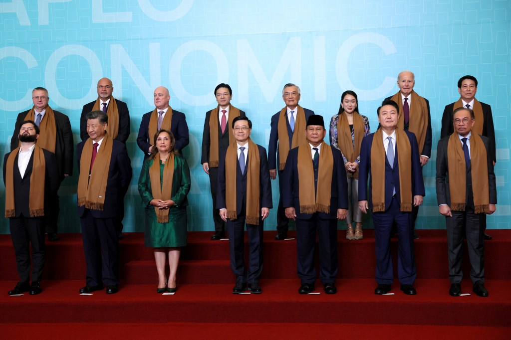 Biden and Xi started their day at the 21-nation summit in Peru, where dignitaries donned brown scarves, as part of the summit's ritual in which world leaders wear traditional garments of the host country for a photo op. 