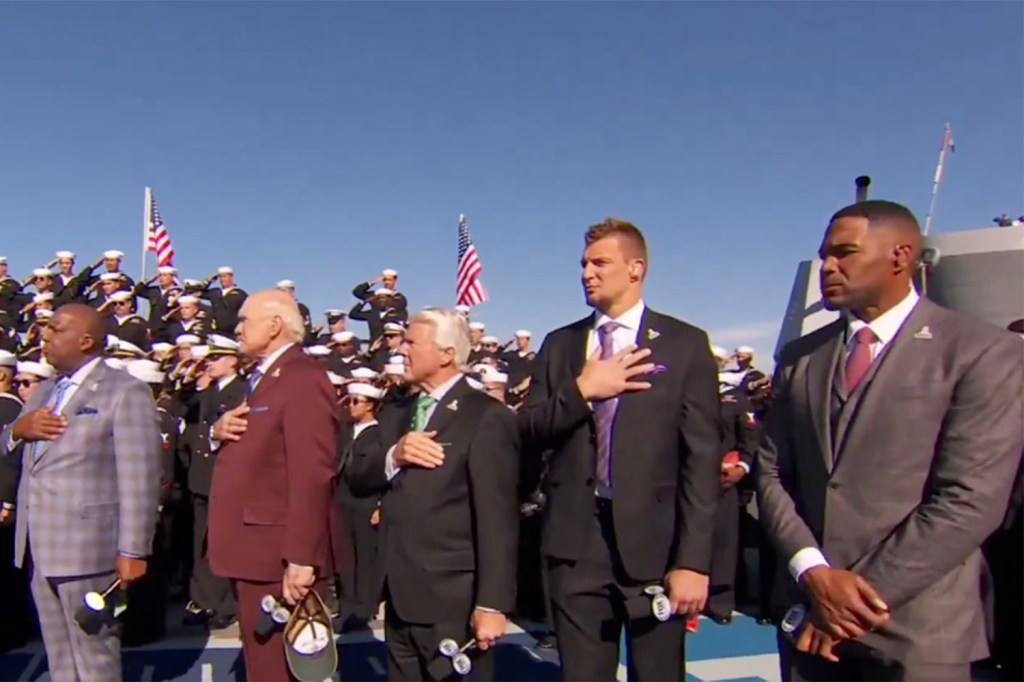 Michael Strahan faced backlash for standing with his arms down during the national anthem on “NFL on Fox” at the Naval Base in San Diego on Nov. 10, 2024.
