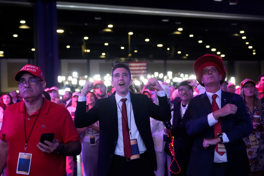 Trump supporters celebrating Trump's election win at the Palm Beach Convention Center.