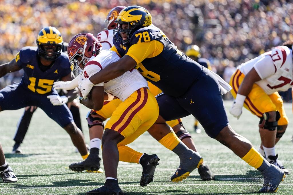 Michigan defensive lineman Kenneth Grant (78) tackles USC running back Woody Marks (4) during the first half at Michigan Stadium in Ann Arbor on Saturday, Sept. 21, 2024.