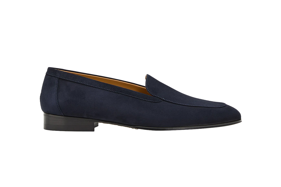 A blue loafer with a pointed toe