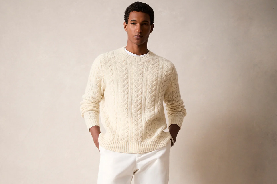 A man in a white sweater