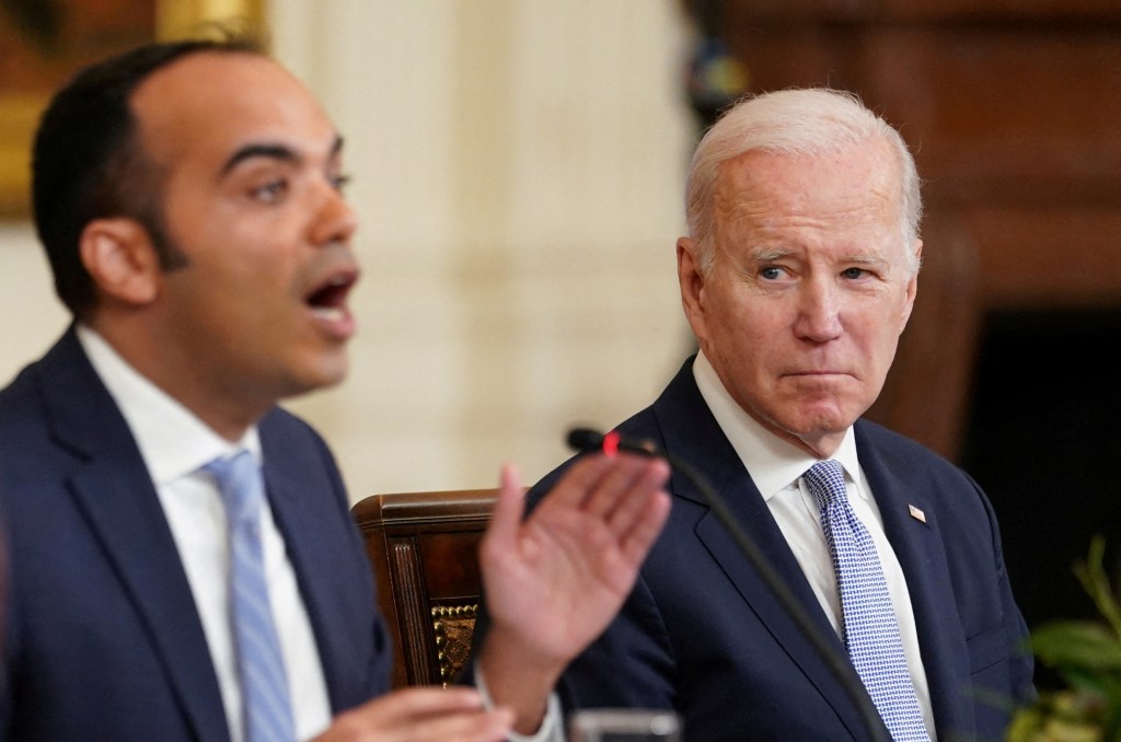 Director of the Consumer Financial Protection Bureau Rohit Chopra and President Biden in 2023.