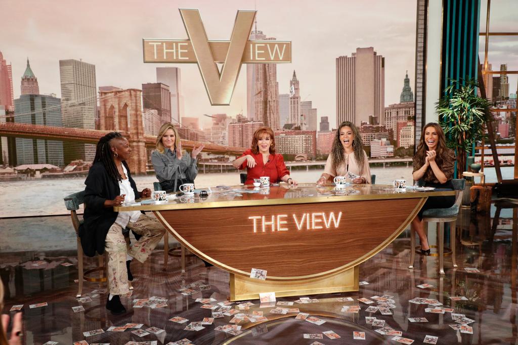 photo of The View's set. Whoopi Goldberg, Sara Haines, Joy Behar, Sunny Hostin and Alyssa Farah Griffin sitting at the anchor table. 