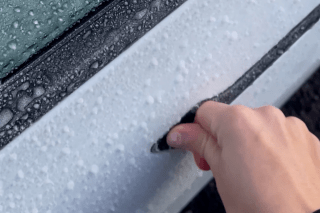 Tesla driver left out in the cold due to frozen-shut door handle