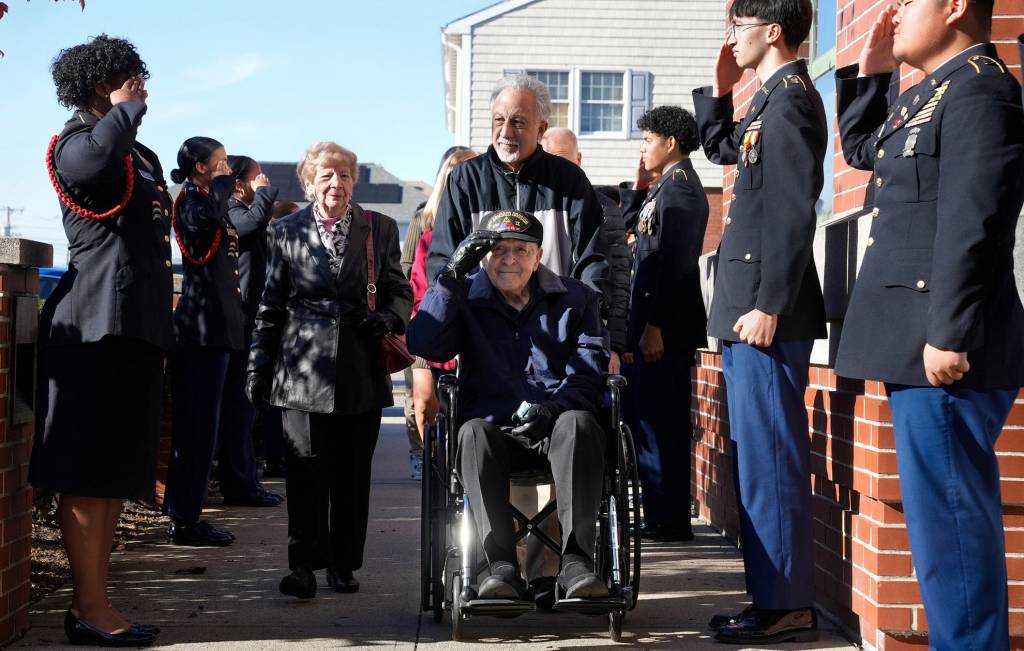 Anthony Simeone being wheeled into the high school 