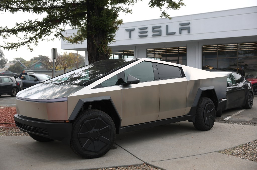 A Tesla Cybertruck is displayed at a Tesla dealership on December 20, 2024 in Corte Madera, California.