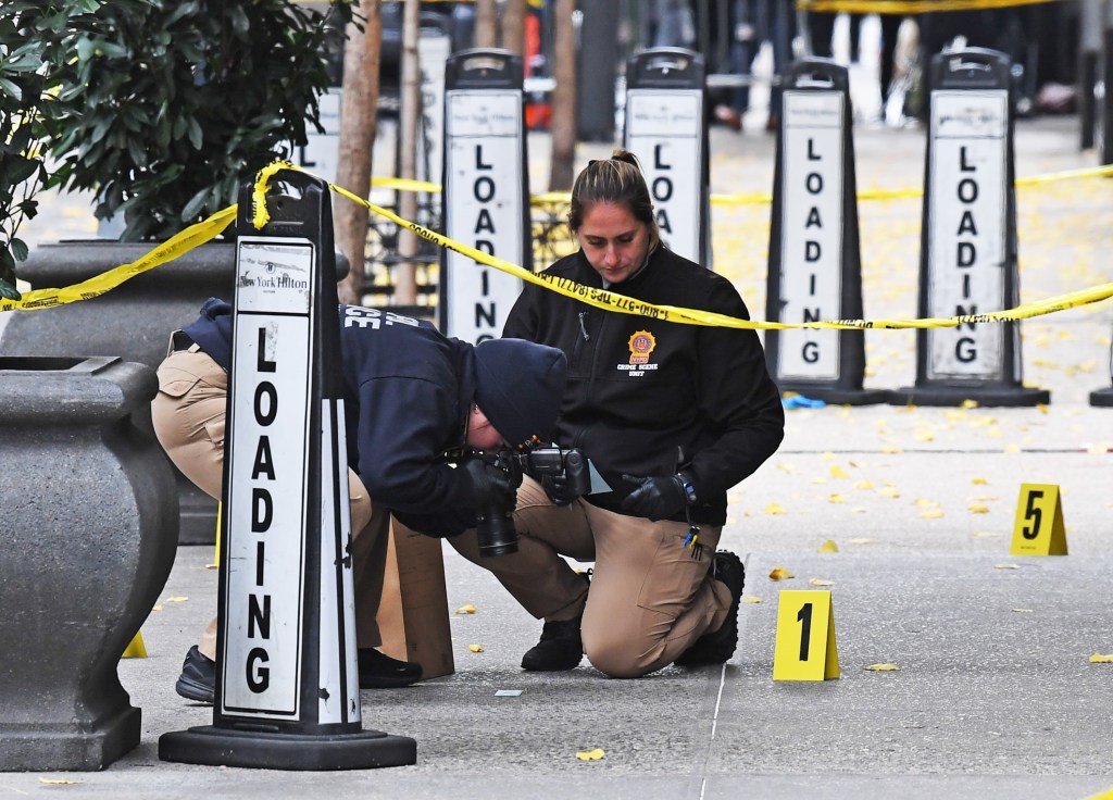 NYPD officers investigating the scene of the shooting.