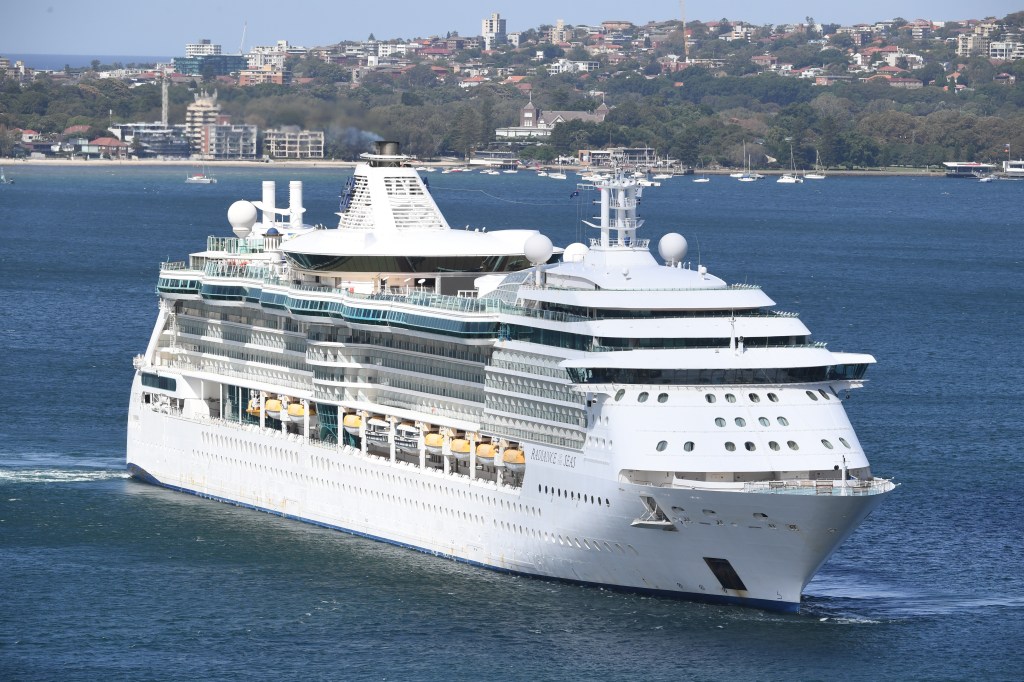 Royal Caribbean's cruise ship, Radiance of the Seas, leaving Sydney Harbour, escorted by Australian Border Vessels and Maritime Police.