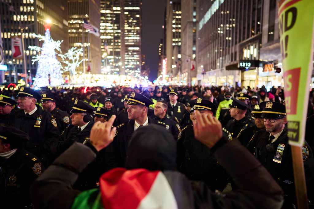 Pro-Palestine protestors during a "Flood the Tree Lighting For Gaza Protest" near the Rockefeller Center tree lighting on Wednesday, November 29, 2023