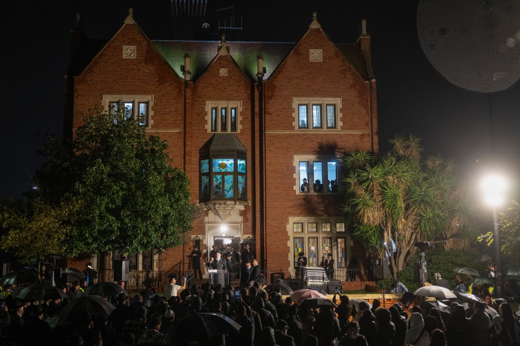 Mourners gather outside Kfar Chabad