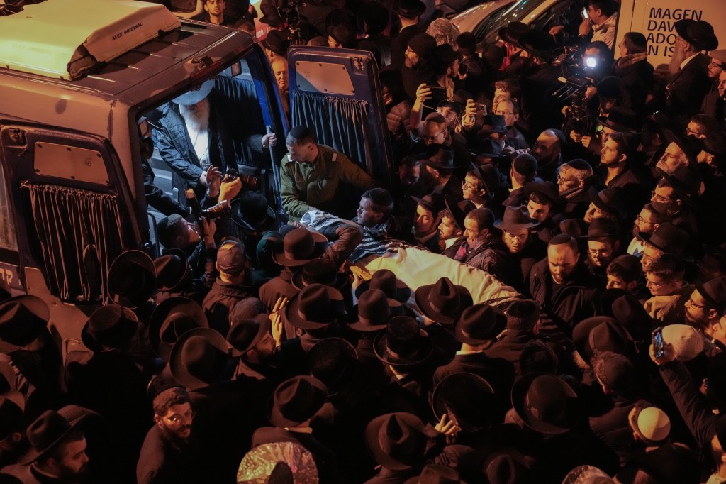 Hundreds gather for Kogan's funeral in Jerusalem on Nov. 26.