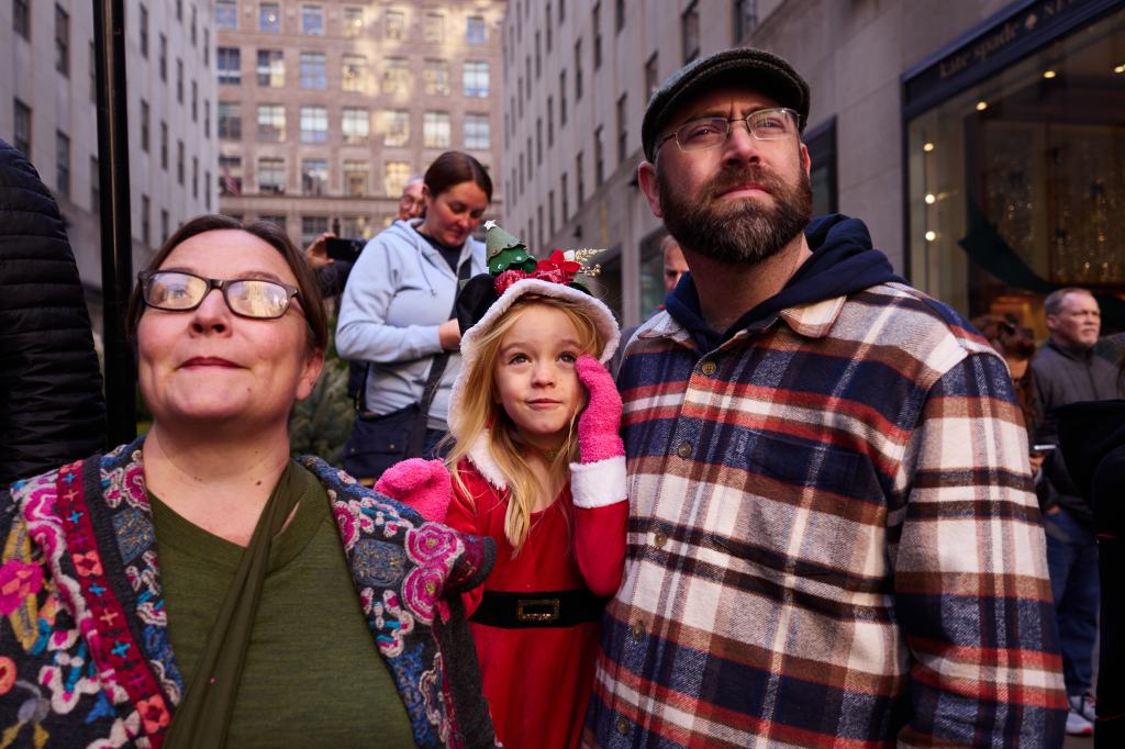 Spectators watch workers lift into place this year's Rockefeller Center Christmas Tree on Saturday, November 9, 2024, in New York, N.Y