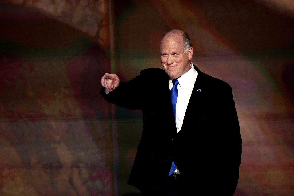 Tom Homan pointing at a crowd while delivering a speech at the Republican National Convention.