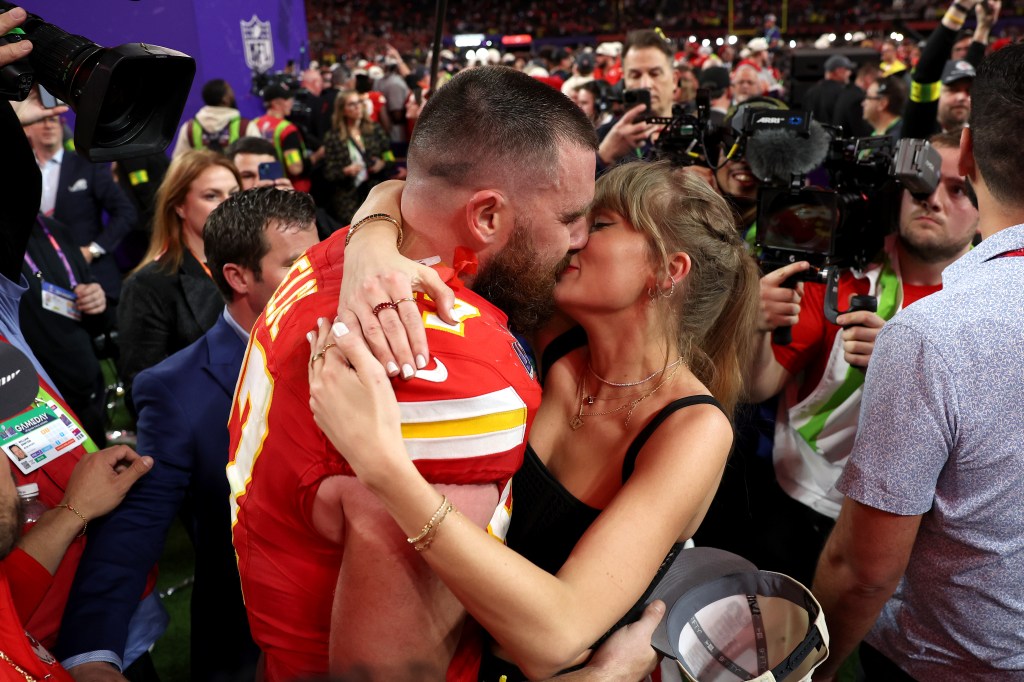 Travis Kelce #87 of the Kansas City Chiefs and Taylor Swift kiss after defeating the San Francisco 49ers in overtime during Super Bowl LVIII at Allegiant Stadium on February 11, 2024 in Las Vegas, Nevada.  