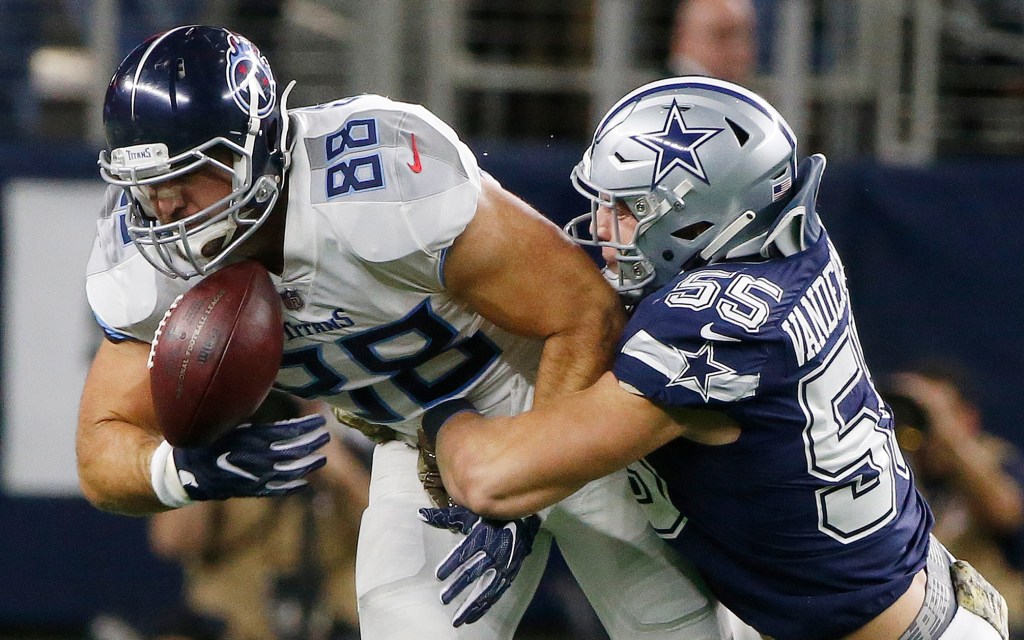 Titans tight end Luke Stocker (88) bobbles the ball as Dallas Cowboys linebacker Leighton Vander Esch (55) defends during the first half of an NFL football game, Monday, Nov. 5, 2018