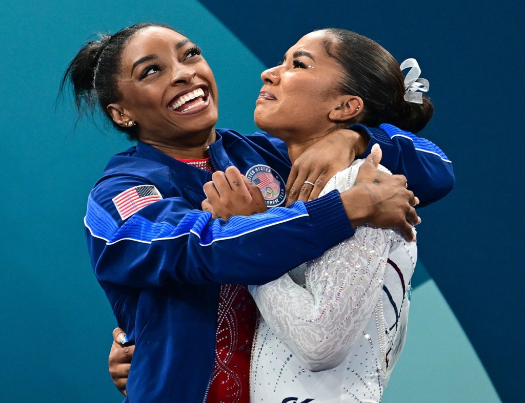 Jordan Chiles of the United States is congratulated by teammate Simone Biles (L) of the United States after dramatically claiming the bronze medal on a score change after the Women's Floor Final during the Artistic Gymnastics competition at the Bercy Arena during the Paris 2024 Summer Olympic Games on August 5, 2024 in Paris, France. 