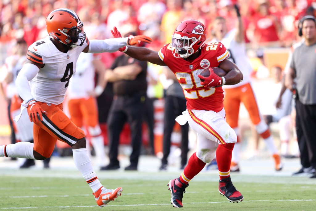 Clyde Edwards-Helaire of the Kansas City Chiefs stiff arming Anthony Walker of the Cleveland Browns during a football game at Arrowhead Stadium.