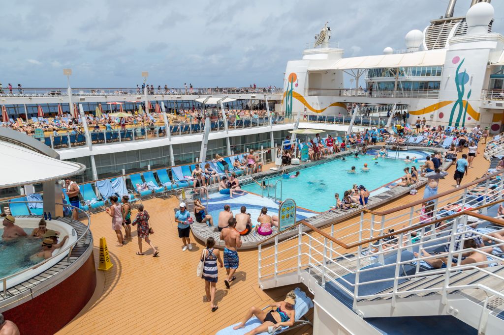 Cruise passengers enjoying the pool deck on the Royal Caribbean Allure of the Seas cruise ship