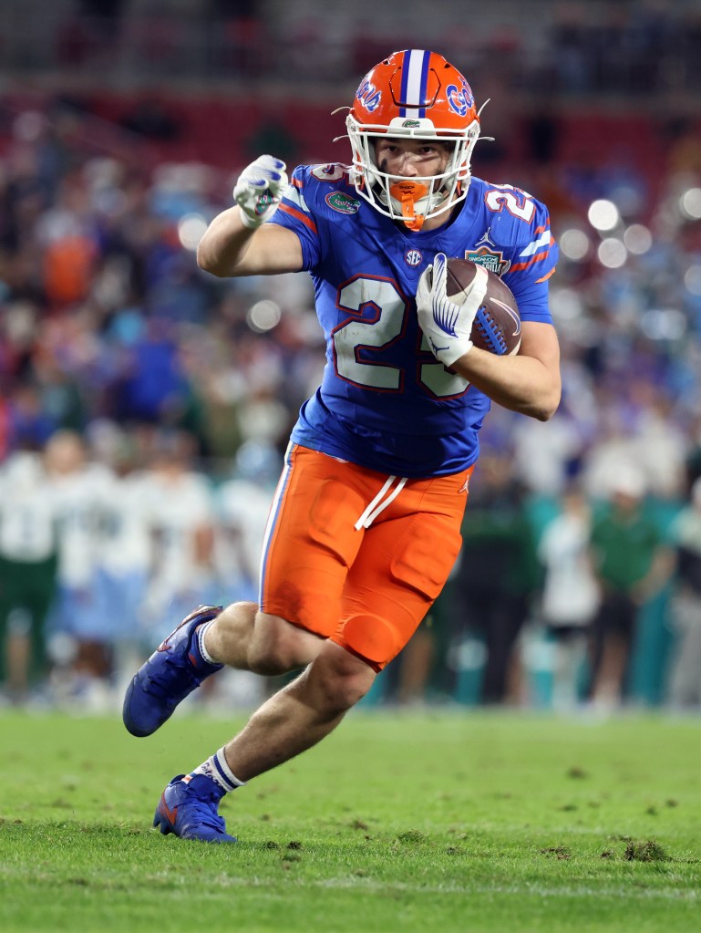 Florida Gators running back Anthony Rubio (25) runs the ball in for a touchdown against the Tulane Green Wave during the second half at Raymond James Stadium.