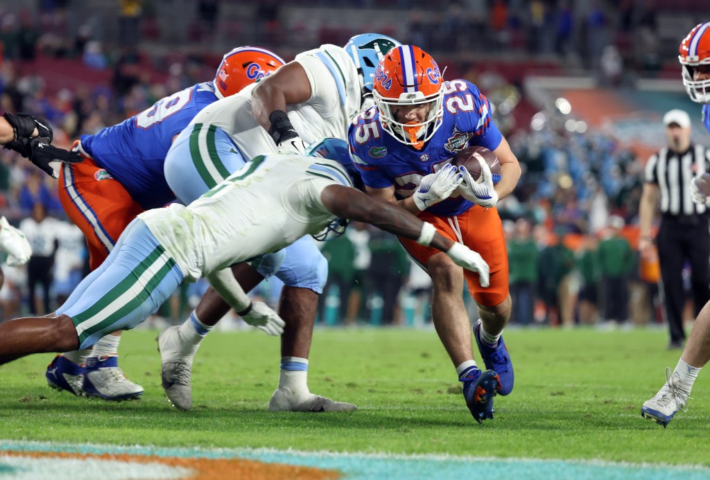 Florida Gators running back Anthony Rubio (25) runs the ball in for a touchdown against the Tulane Green Wave during the second half at Raymond James Stadium.