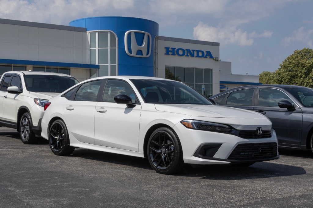 Honda Civic 4D Sport display at a dealership.