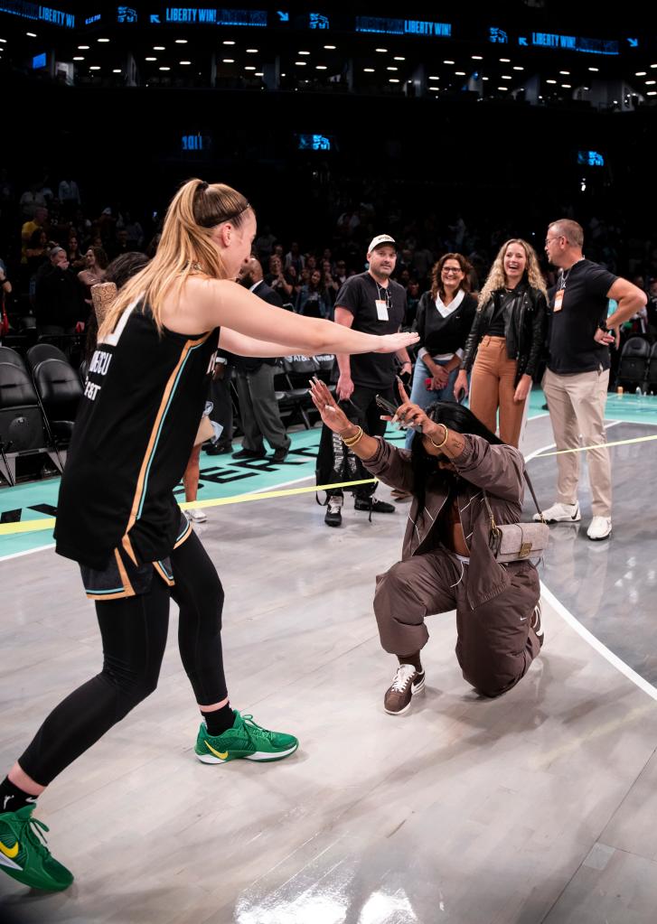 Liberty guard Sabrina Ionescu greets Jordan Chiles after win over Las Vegas Aces during a regular season matchup at Barclays Center on September 8, 2024.