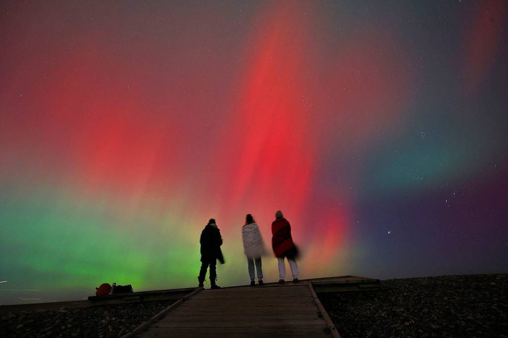 Sky watchers view the Northern Lights at Egypt Beach in Scituate Massachusetts