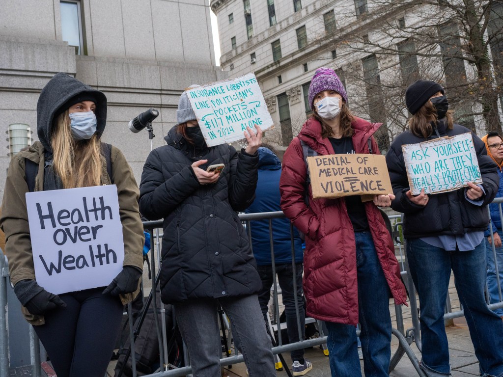 Young women protesting in favor of Luigi Mangione