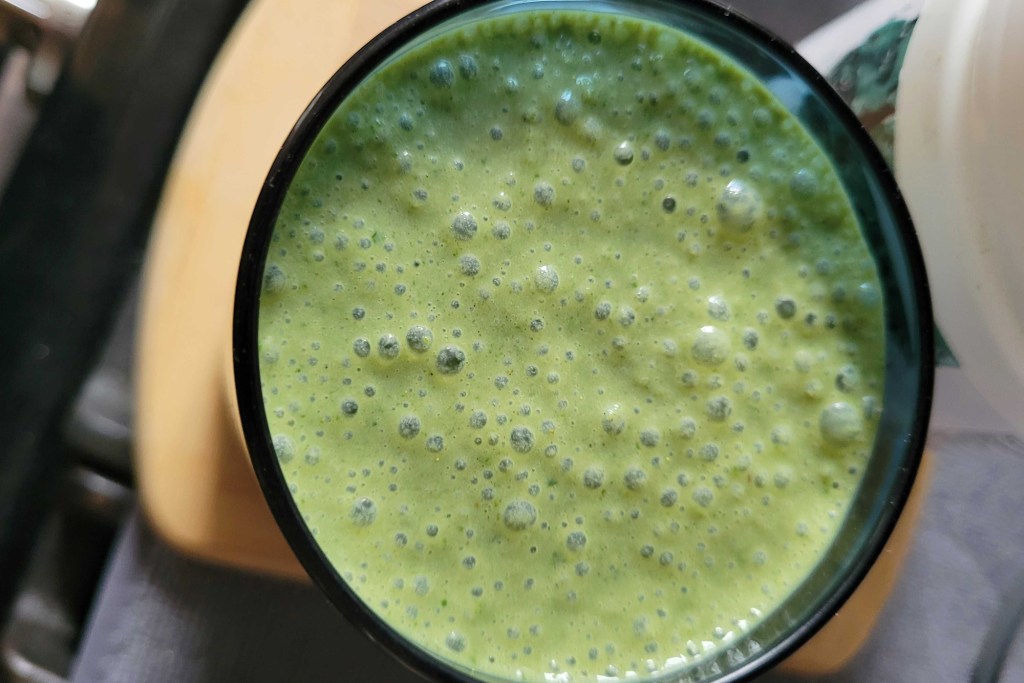 A green smoothie in a mug