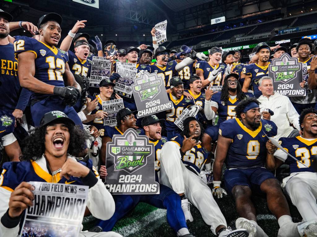 Toledo Rockets celebrate their win against the Pittsburgh Panthers after six overtimes of the 2024 GameAbove Sports Bowl at Ford Field in Detroit.
