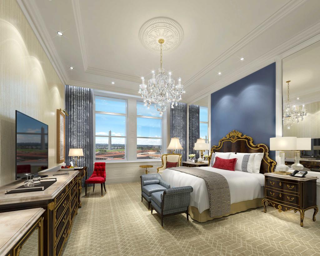 Luxurious bedroom in Trump hotel, featuring a large bed and television, located in Washington, DC.